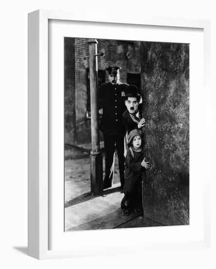The Kid, Tom Wilson, Charles Chaplin, Jackie Coogan, 1921-null-Framed Photo