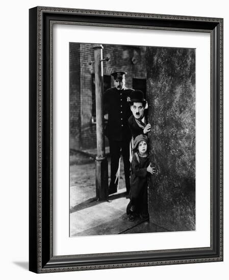 The Kid, Tom Wilson, Charles Chaplin, Jackie Coogan, 1921-null-Framed Photo