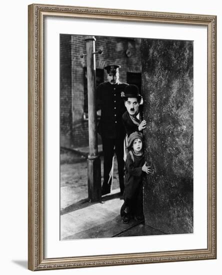 The Kid, Tom Wilson, Charles Chaplin, Jackie Coogan, 1921-null-Framed Photo