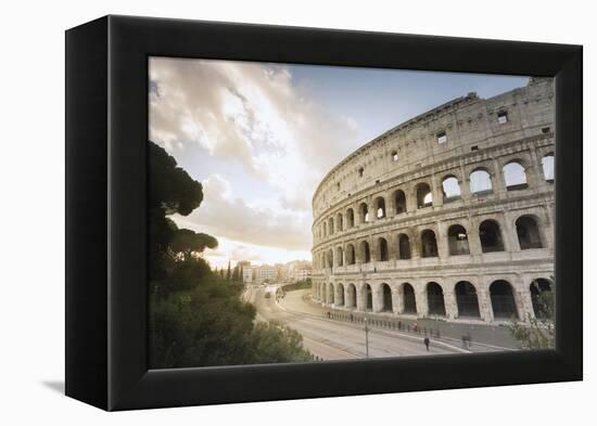 The lights of sunrise frame the ancient Colosseum (Flavian Amphitheatre), UNESCO World Heritage Sit-Roberto Moiola-Framed Premier Image Canvas