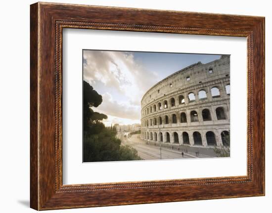 The lights of sunrise frame the ancient Colosseum (Flavian Amphitheatre), UNESCO World Heritage Sit-Roberto Moiola-Framed Photographic Print