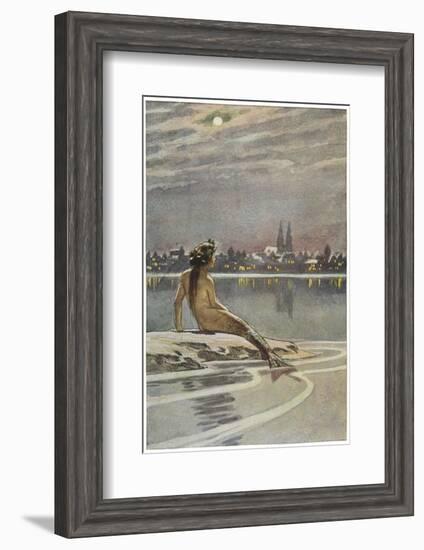 The Little Mermaid Sits on a Rock and Gazes at the Lights of the Distant Town-Paul Hey-Framed Photographic Print