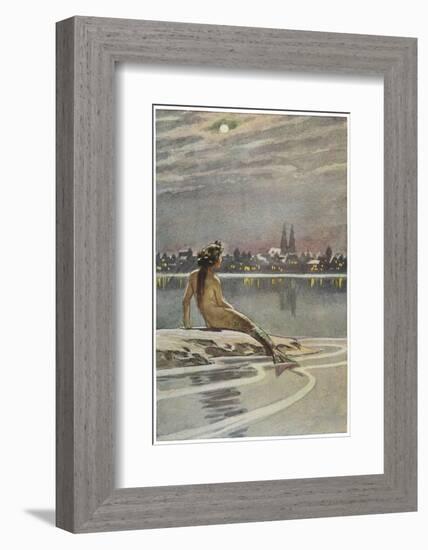 The Little Mermaid Sits on a Rock and Gazes at the Lights of the Distant Town-Paul Hey-Framed Photographic Print