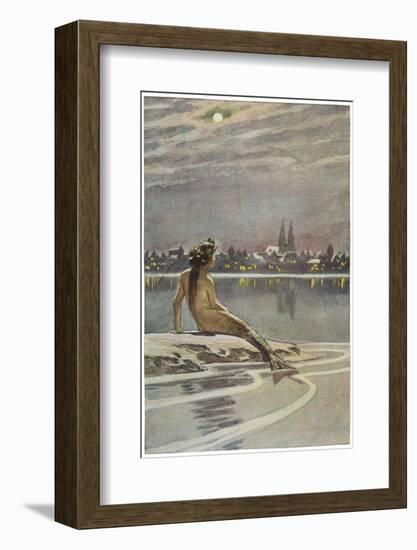 The Little Mermaid Sits on a Rock and Gazes at the Lights of the Distant Town-Paul Hey-Framed Photographic Print