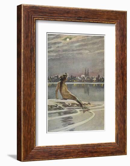 The Little Mermaid Sits on a Rock and Gazes at the Lights of the Distant Town-Paul Hey-Framed Photographic Print