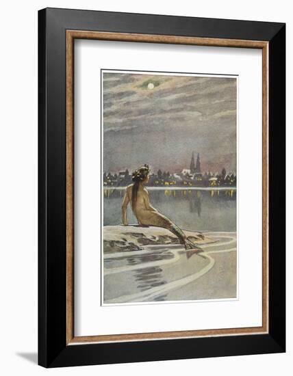 The Little Mermaid Sits on a Rock and Gazes at the Lights of the Distant Town-Paul Hey-Framed Photographic Print