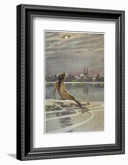 The Little Mermaid Sits on a Rock and Gazes at the Lights of the Distant Town-Paul Hey-Framed Photographic Print