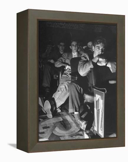 The Local Movie Theater, Boys Have a Very Difficult Time Finding a Place to Put Their Long Legs-Nina Leen-Framed Premier Image Canvas