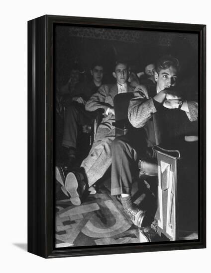 The Local Movie Theater, Boys Have a Very Difficult Time Finding a Place to Put Their Long Legs-Nina Leen-Framed Premier Image Canvas