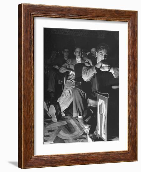 The Local Movie Theater, Boys Have a Very Difficult Time Finding a Place to Put Their Long Legs-Nina Leen-Framed Photographic Print