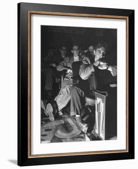 The Local Movie Theater, Boys Have a Very Difficult Time Finding a Place to Put Their Long Legs-Nina Leen-Framed Photographic Print