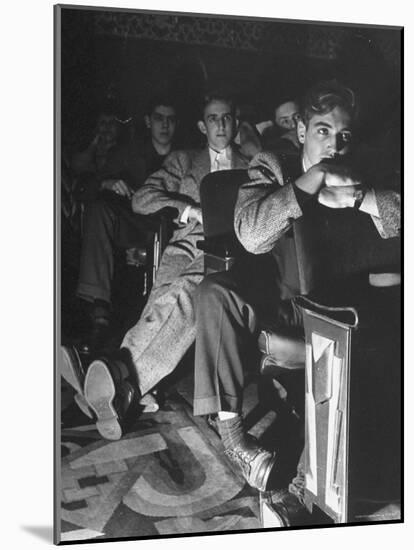 The Local Movie Theater, Boys Have a Very Difficult Time Finding a Place to Put Their Long Legs-Nina Leen-Mounted Photographic Print