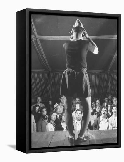 The Man from Mars Demonstrating How His Head Has Grown Since Entering the Army at Beginning of War-Cornell Capa-Framed Premier Image Canvas