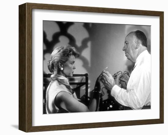 THE MAN WHO KNEW TOO MUCH, 1956 On the set, Alfred Hitchcock directs Doris Day (b/w photo)-null-Framed Photo