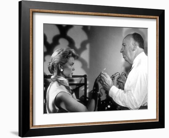 THE MAN WHO KNEW TOO MUCH, 1956 On the set, Alfred Hitchcock directs Doris Day (b/w photo)-null-Framed Photo