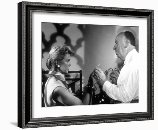 THE MAN WHO KNEW TOO MUCH, 1956 On the set, Alfred Hitchcock directs Doris Day (b/w photo)-null-Framed Photo