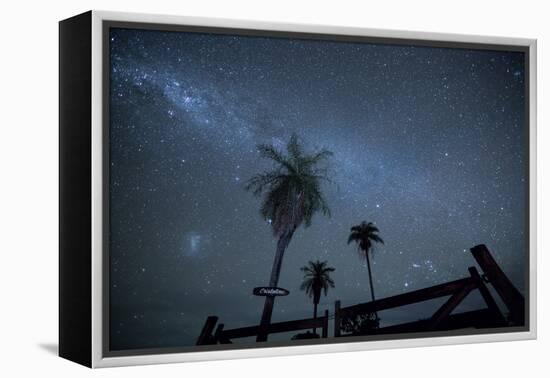 The Milky Way Above Palm Trees and a Wooden Farm Gate-Alex Saberi-Framed Premier Image Canvas