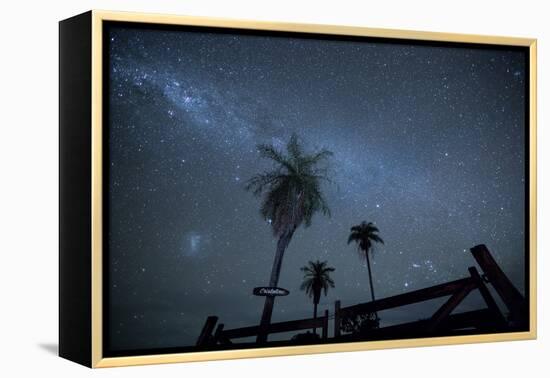 The Milky Way Above Palm Trees and a Wooden Farm Gate-Alex Saberi-Framed Premier Image Canvas