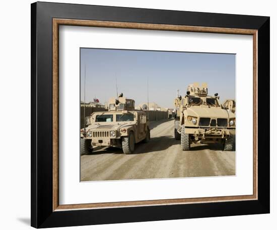 The Mine Resistant Ambush Protected All Terrain Vehicle and its Predecessor, the Humvee-null-Framed Photographic Print