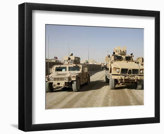 The Mine Resistant Ambush Protected All Terrain Vehicle and its Predecessor, the Humvee-null-Framed Photographic Print