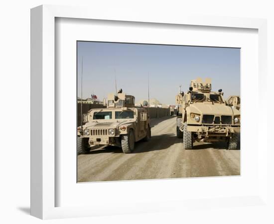 The Mine Resistant Ambush Protected All Terrain Vehicle and its Predecessor, the Humvee-null-Framed Photographic Print