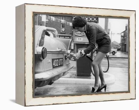 The Modern Female Petrol Pump Operator Refuelling a Car in Her Mini Skirt-null-Framed Premier Image Canvas