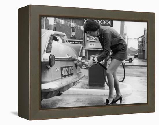 The Modern Female Petrol Pump Operator Refuelling a Car in Her Mini Skirt-null-Framed Premier Image Canvas