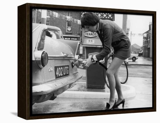 The Modern Female Petrol Pump Operator Refuelling a Car in Her Mini Skirt-null-Framed Premier Image Canvas