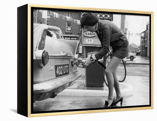 The Modern Female Petrol Pump Operator Refuelling a Car in Her Mini Skirt-null-Framed Premier Image Canvas
