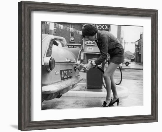 The Modern Female Petrol Pump Operator Refuelling a Car in Her Mini Skirt-null-Framed Photographic Print