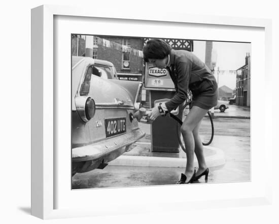 The Modern Female Petrol Pump Operator Refuelling a Car in Her Mini Skirt-null-Framed Photographic Print