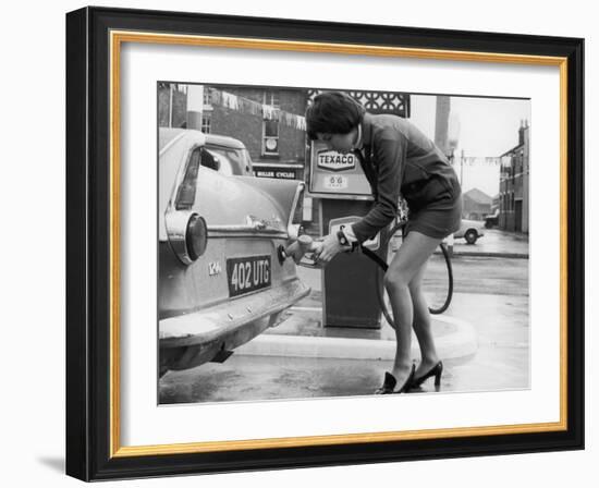 The Modern Female Petrol Pump Operator Refuelling a Car in Her Mini Skirt-null-Framed Photographic Print