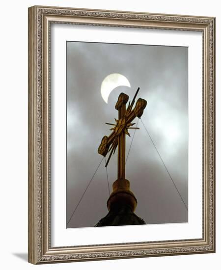 The Moon Partially Covers the Sun During a Partial Solar Eclipse-null-Framed Photographic Print