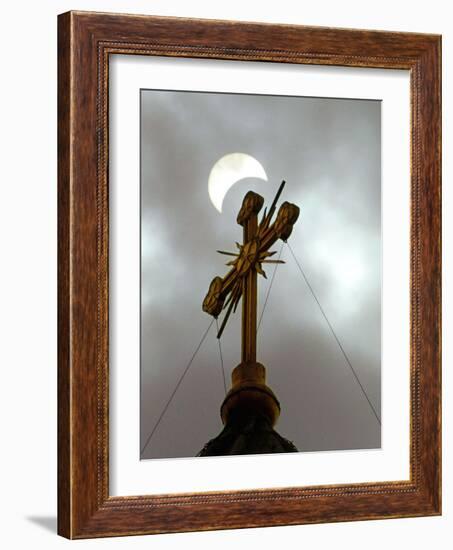 The Moon Partially Covers the Sun During a Partial Solar Eclipse-null-Framed Photographic Print