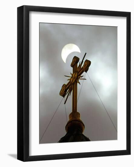 The Moon Partially Covers the Sun During a Partial Solar Eclipse-null-Framed Photographic Print