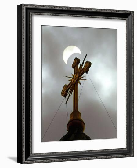 The Moon Partially Covers the Sun During a Partial Solar Eclipse-null-Framed Photographic Print