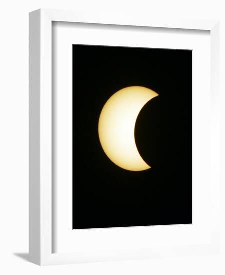 The Moon Partially Covers the Sun During the Peak of an Annular Eclipse Seen from Tel Aviv-null-Framed Photographic Print