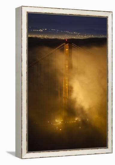 The North Tower Of The Golden Gate Bridge At Night With Fog Swirling In The Lights-Joe Azure-Framed Premier Image Canvas