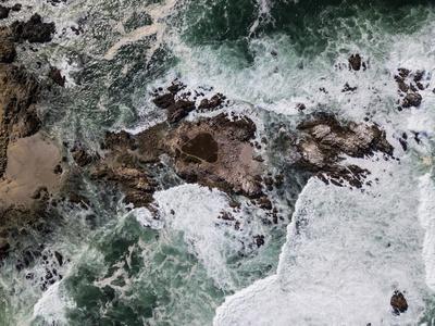 The Pacific Ocean washes against the rocky and scenic coastline of the ...