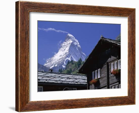 The Peak of the Matterhorn Mountain Towering Above Chalet Rooftops, Swiss Alps, Switzerland-Ruth Tomlinson-Framed Photographic Print