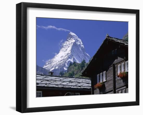 The Peak of the Matterhorn Mountain Towering Above Chalet Rooftops, Swiss Alps, Switzerland-Ruth Tomlinson-Framed Photographic Print