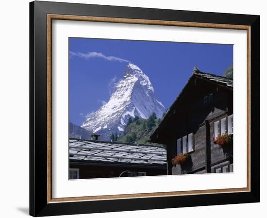 The Peak of the Matterhorn Mountain Towering Above Chalet Rooftops, Swiss Alps, Switzerland-Ruth Tomlinson-Framed Photographic Print