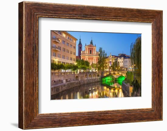 The pink Franciscan Church of the Annunciation, Ljubljanica River and the Triple Bridge, Slovenia-Neale Clark-Framed Photographic Print