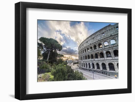 The pink sky at sunrise frames the ancient Colosseum (Flavian Amphitheatre), UNESCO World Heritage -Roberto Moiola-Framed Photographic Print