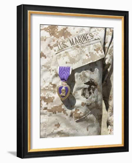 The Purple Heart Award Hangs over the Heart of a U.S. Marine-Stocktrek Images-Framed Photographic Print