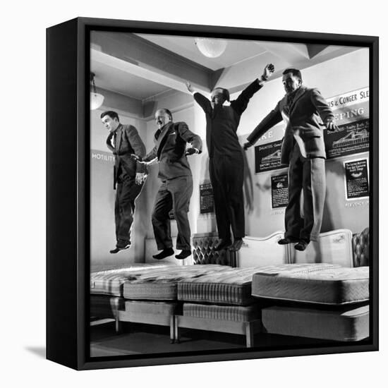 The Salesmen Showing How Not to Test a Bed at Lewis and Conger-George Silk-Framed Premier Image Canvas