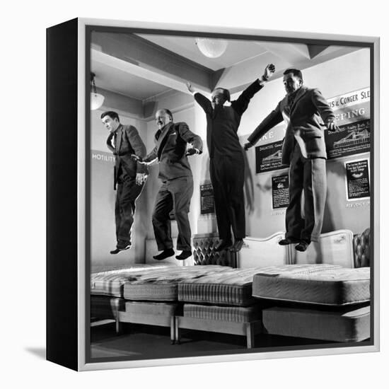 The Salesmen Showing How Not to Test a Bed at Lewis and Conger-George Silk-Framed Premier Image Canvas