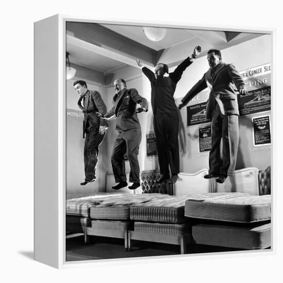 The Salesmen Showing How Not to Test a Bed at Lewis and Conger-George Silk-Framed Premier Image Canvas