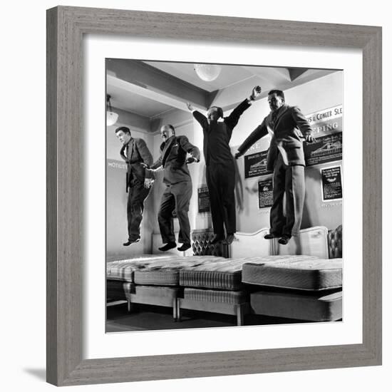 The Salesmen Showing How Not to Test a Bed at Lewis and Conger-George Silk-Framed Photographic Print