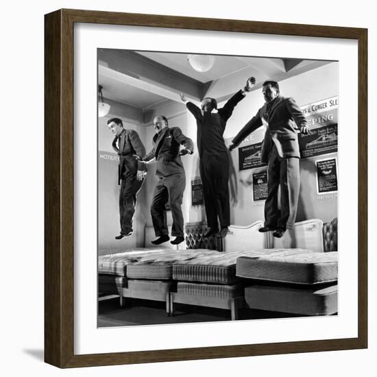 The Salesmen Showing How Not to Test a Bed at Lewis and Conger-George Silk-Framed Photographic Print